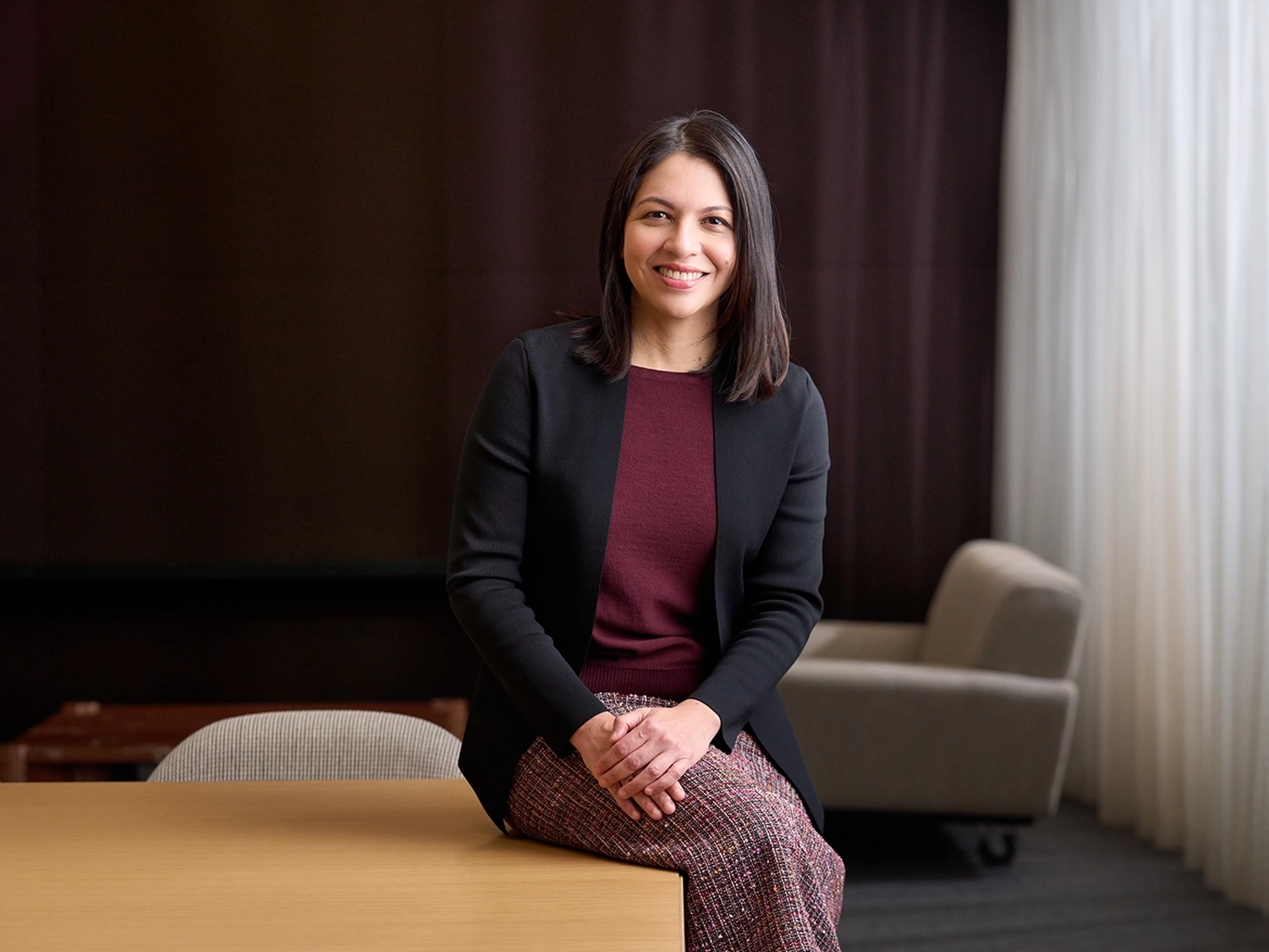 A professional portrait of Kathleen Peacock in a Morningstar office.