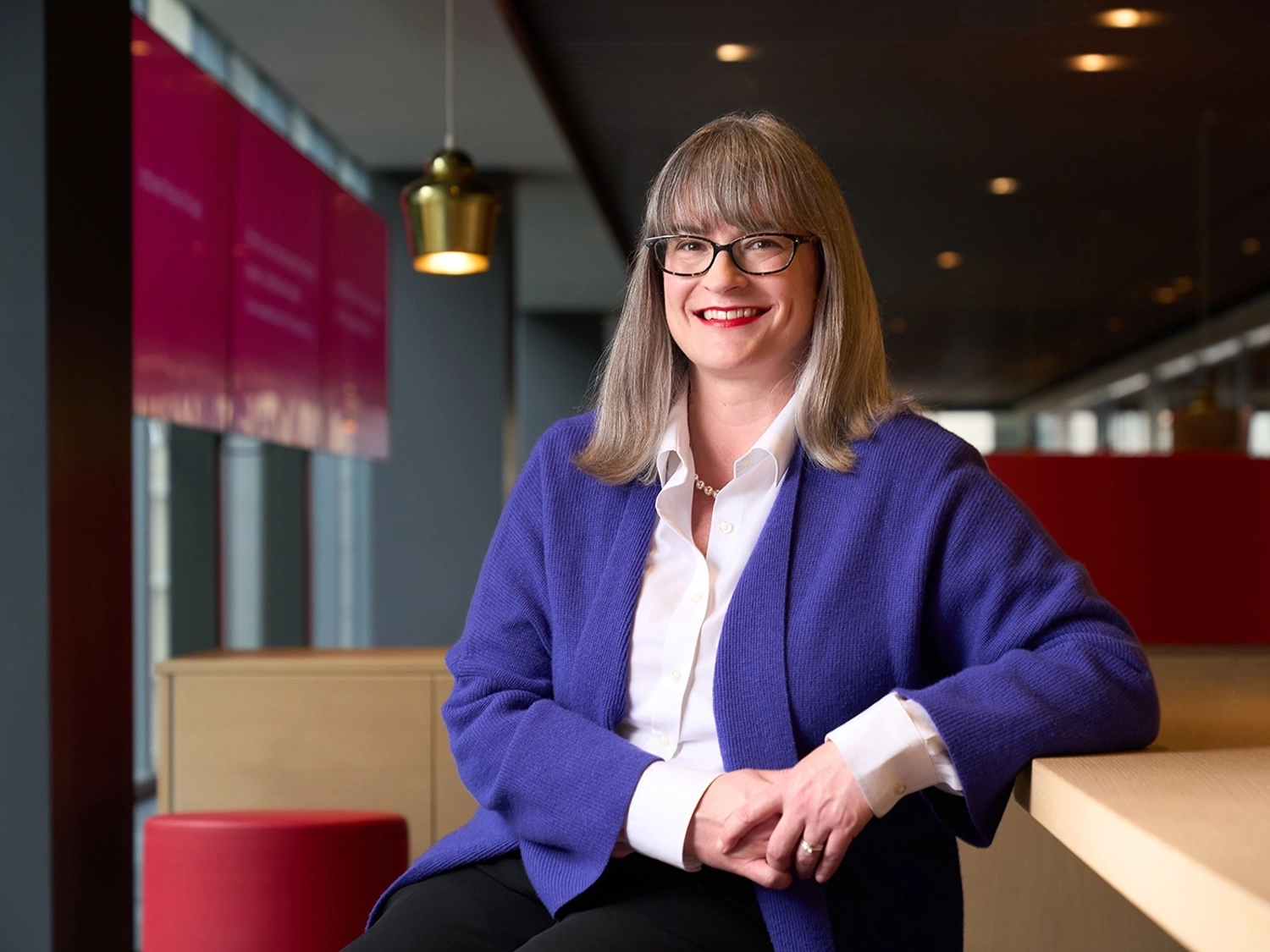 A professional portrait of Elizabeth Collins in the Chicago Morningstar office.