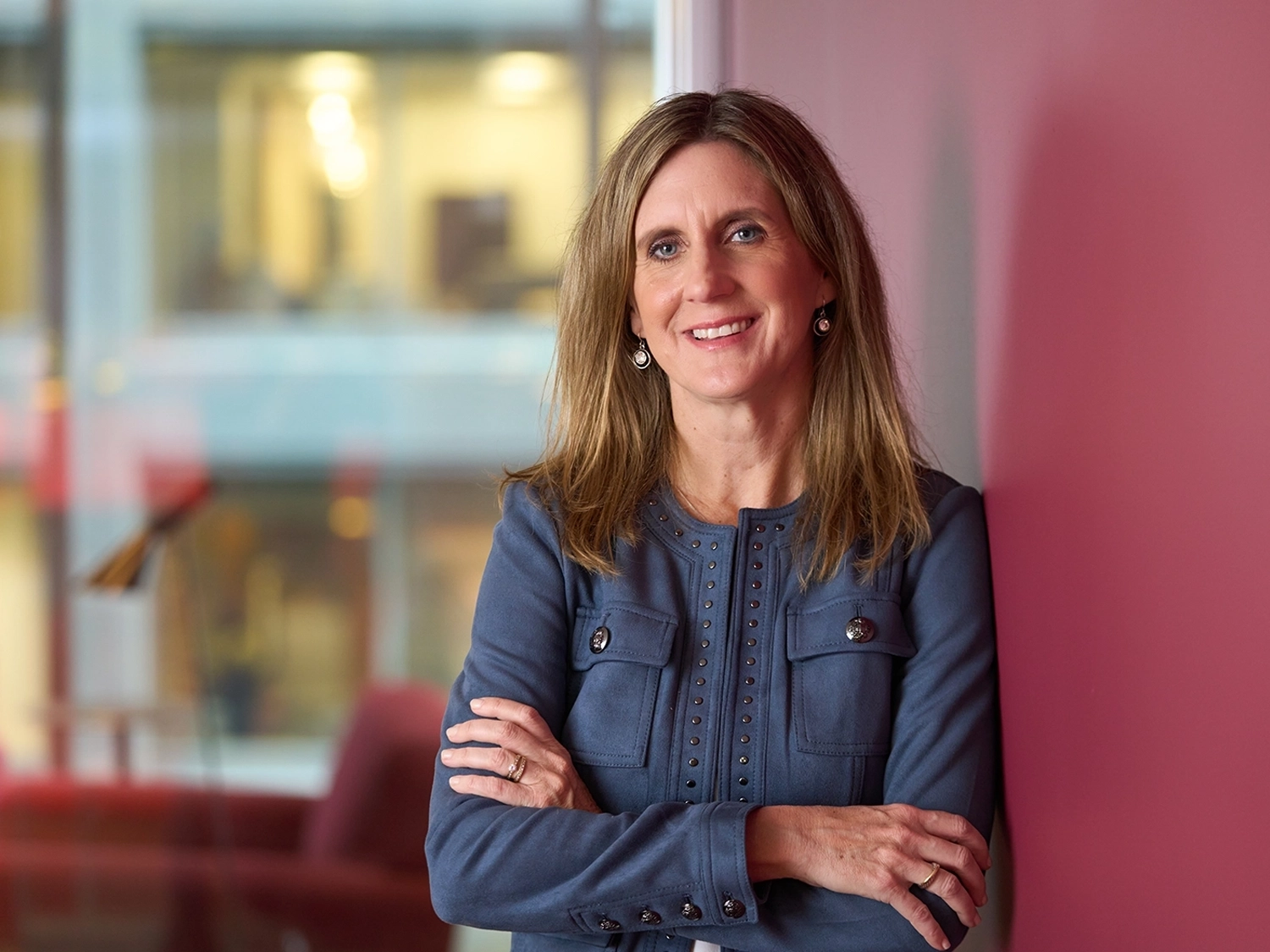A professional portrait of Marie Trzupek Lynch in the Chicago Morningstar office.