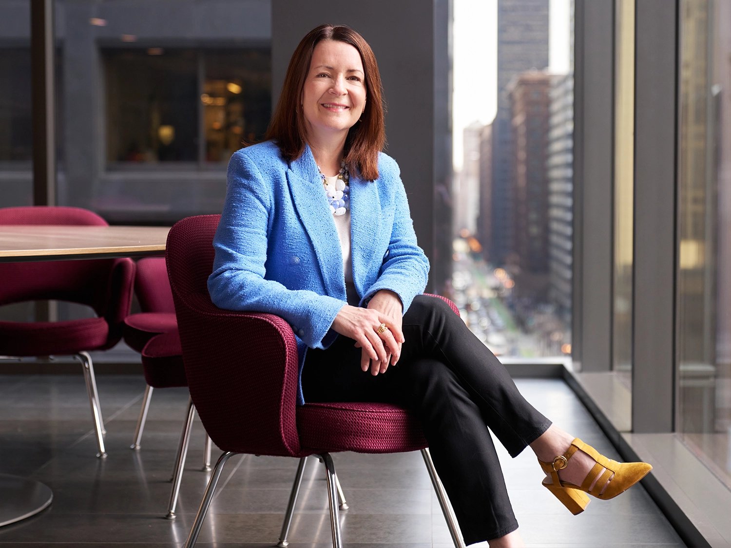 A professional portrait of Julie Willoughby in the Morningstar Chicago Office.