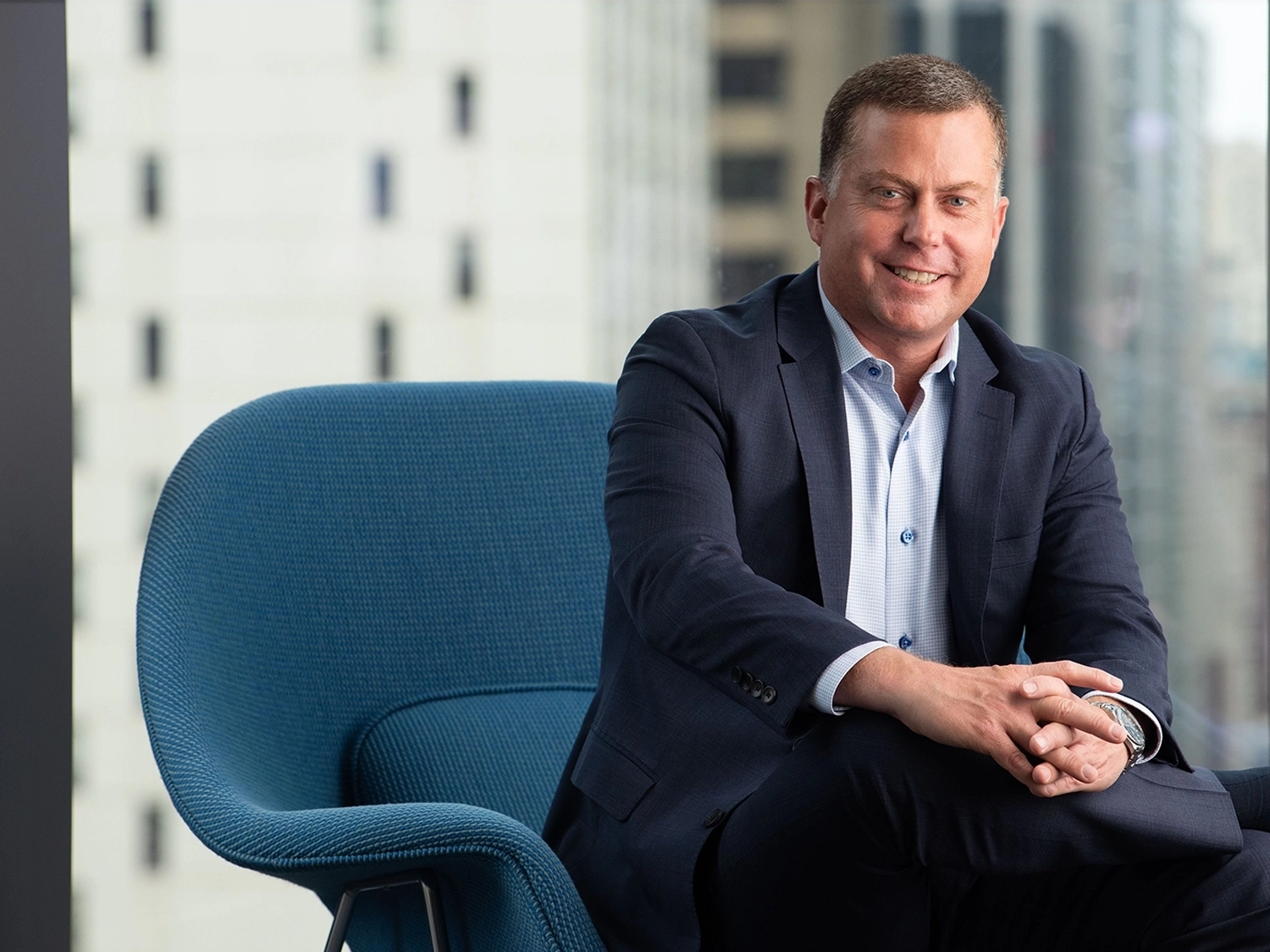 A professional portrait of Brock Johnson in the Chicago Morningstar office.