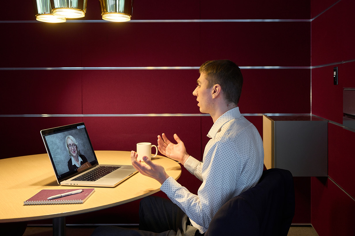 Morningstar employee participating in a video call from a focus room.