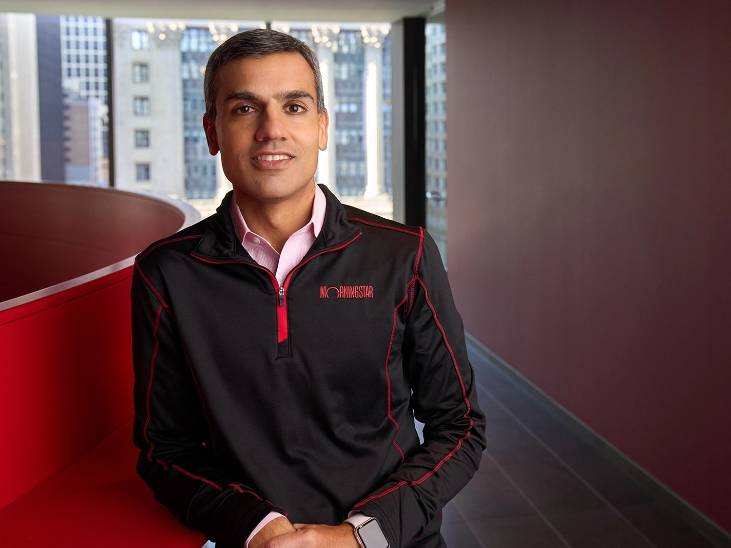 A professional portrait of Kunal Kapoor in the Chicago office wearing a Morningstar jacket.