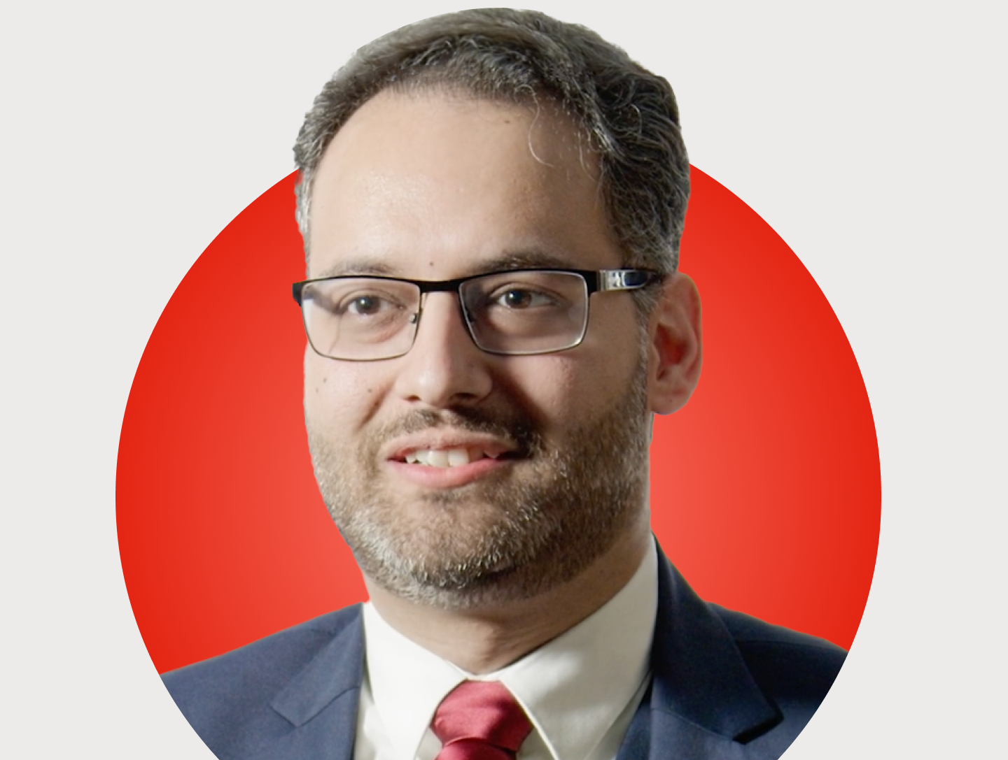Headshot of Gauhar Mahmood on a red circular background.