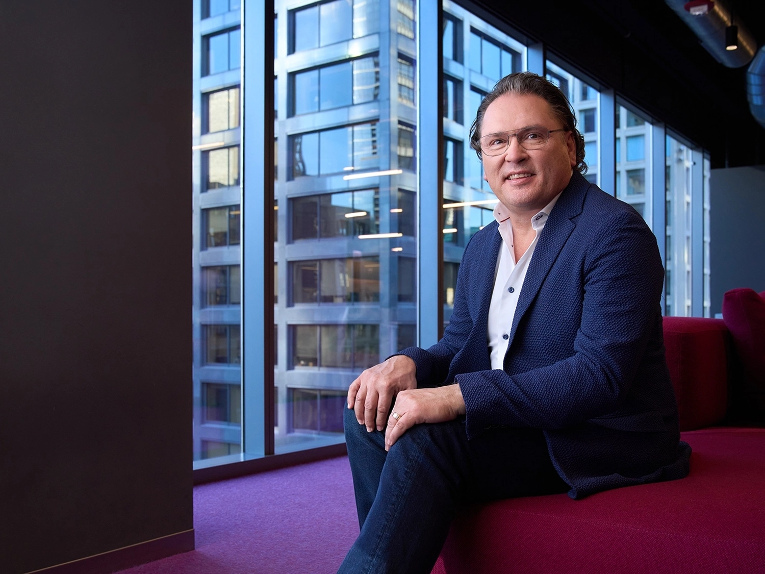 A professional portrait of Ron Bundy in the Chicago Morningstar office.