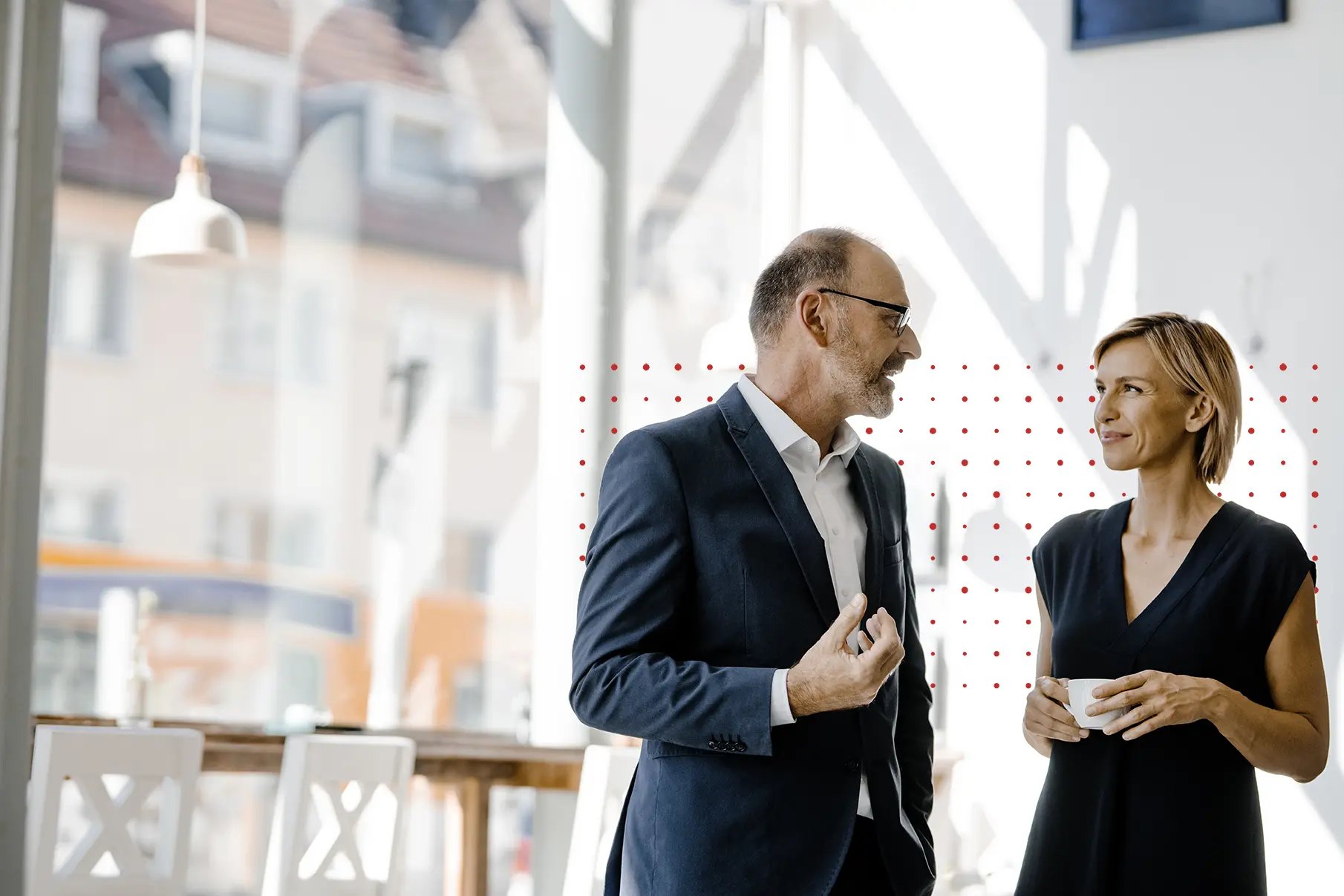 2 business people talking.